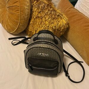 Back and grey Guess backpack purse
